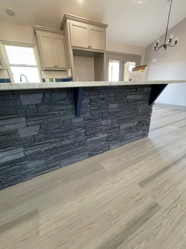 Stone-wrapped kitchen island