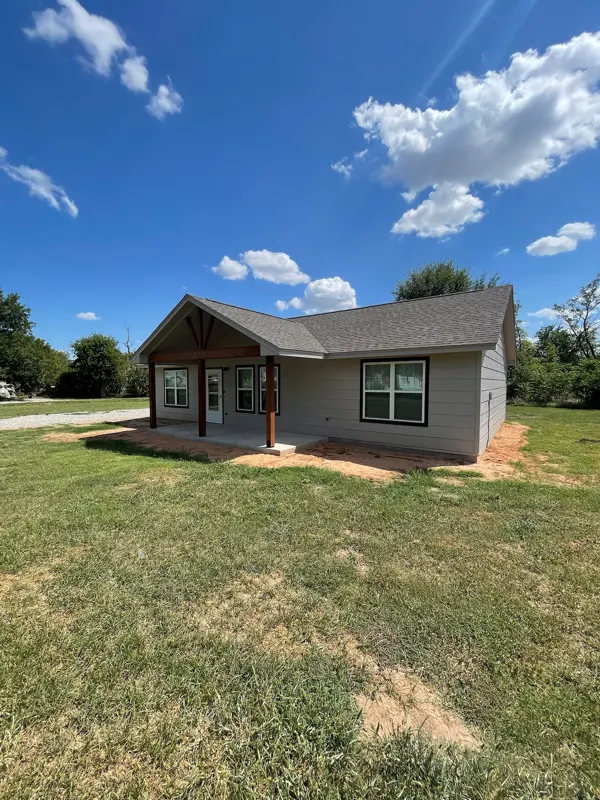 Gray-sided home with a front lawn