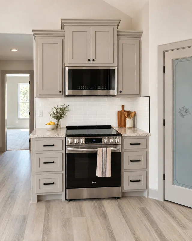 Kitchen range wall with gray cabinets