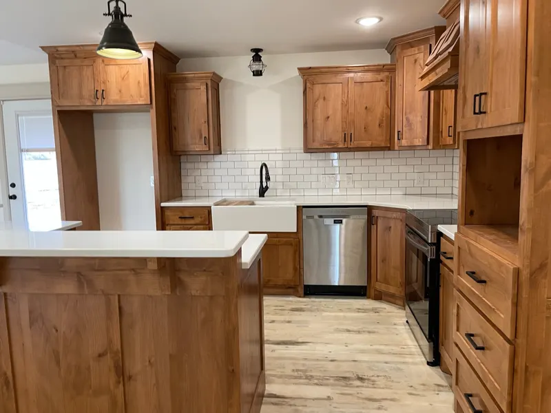 Kitchen with wood cabinets and farmhouse sink