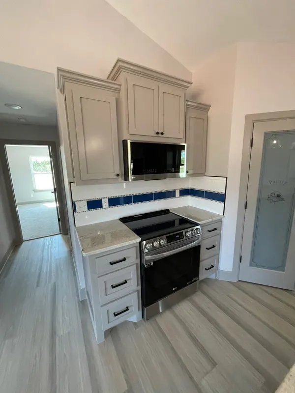Kitchen with blue tile accent