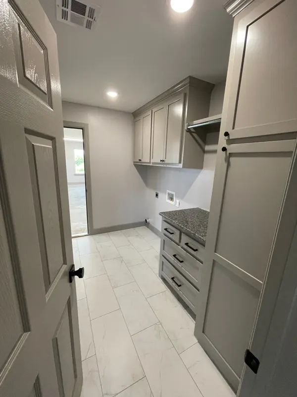 Laundry room with cabinets