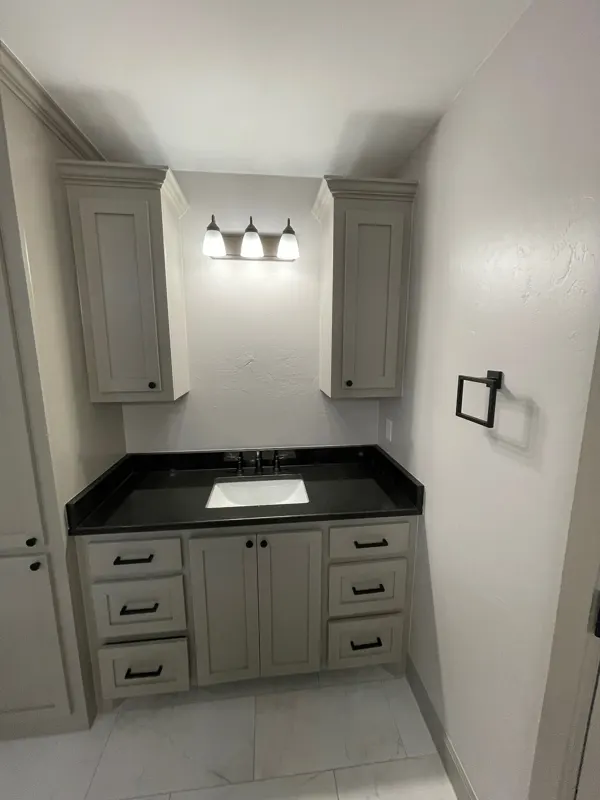 Bathroom vanity with black countertop