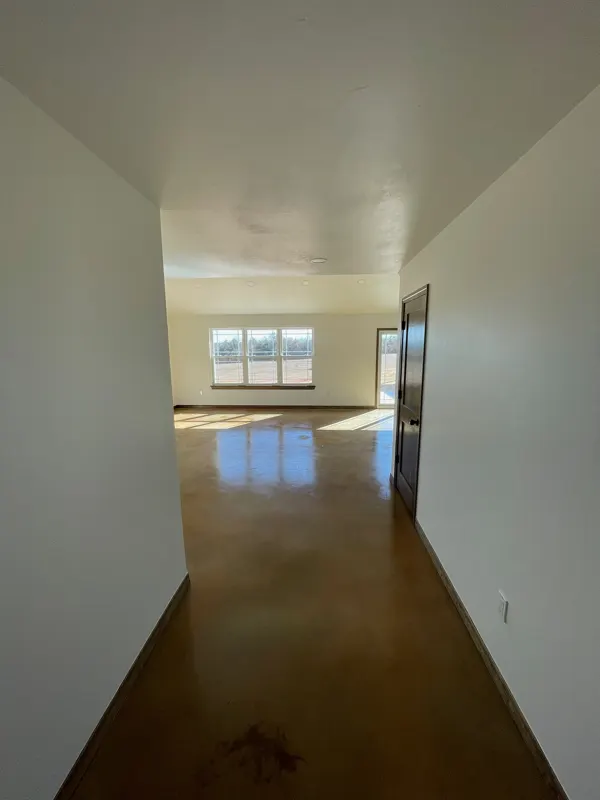 Hallway with stained concrete floors