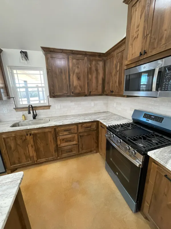 Kitchen with gas range and wood cabinets